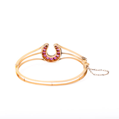 VINTAGE 18K YELLOW GOLD DIAMOND AND RUBY HORSESHOE BANGLE