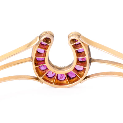 VINTAGE 18K YELLOW GOLD DIAMOND AND RUBY HORSESHOE BANGLE