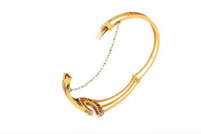 VINTAGE 18K YELLOW GOLD DIAMOND AND RUBY HORSESHOE BANGLE