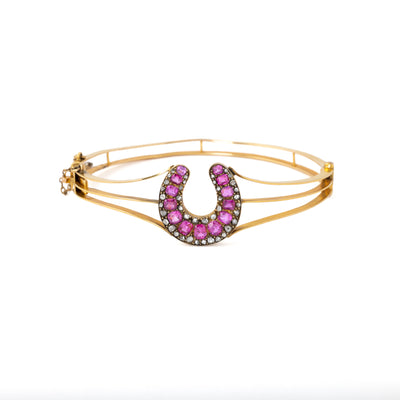 VINTAGE 18K YELLOW GOLD DIAMOND AND RUBY HORSESHOE BANGLE