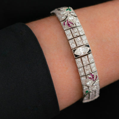 ART DECO PLATINUM OLD EUROPEAN CUT AND CARRE CUT DIAMOND AND COLOMBIAN EMERALD, ONYX AND RUBY c.1920s