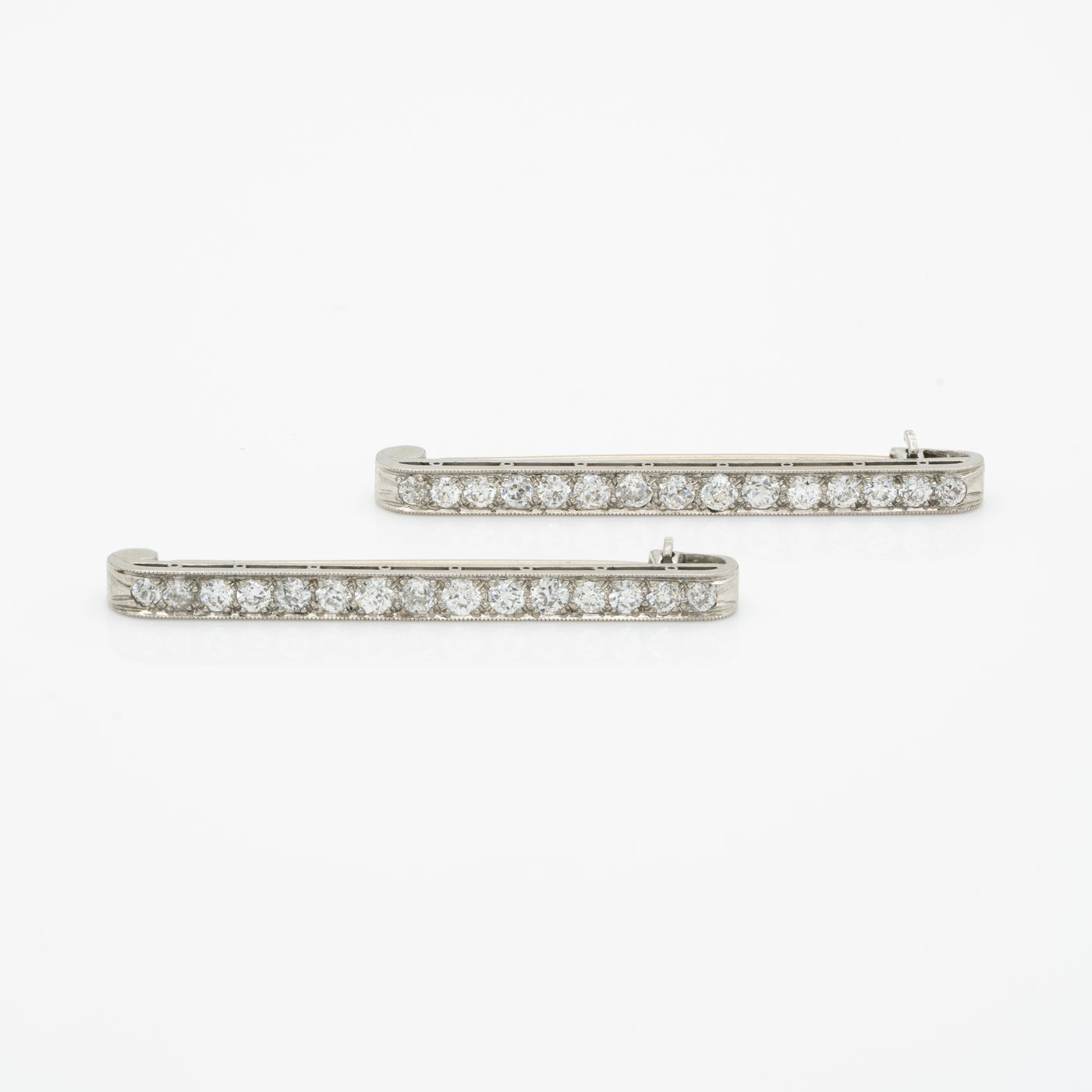 ART DECO PLATINUM AND DIAMOND MATCHING PAIR BAR BROOCHES c.1925