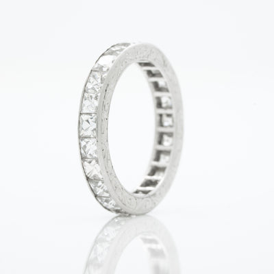 HAND ENGRAVED PLATINUM AND 4.0CTS. FRENCH CUT DIAMOND ETERNITY RING