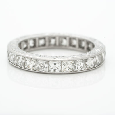 HAND ENGRAVED PLATINUM AND 4.0CTS. FRENCH CUT DIAMOND ETERNITY RING