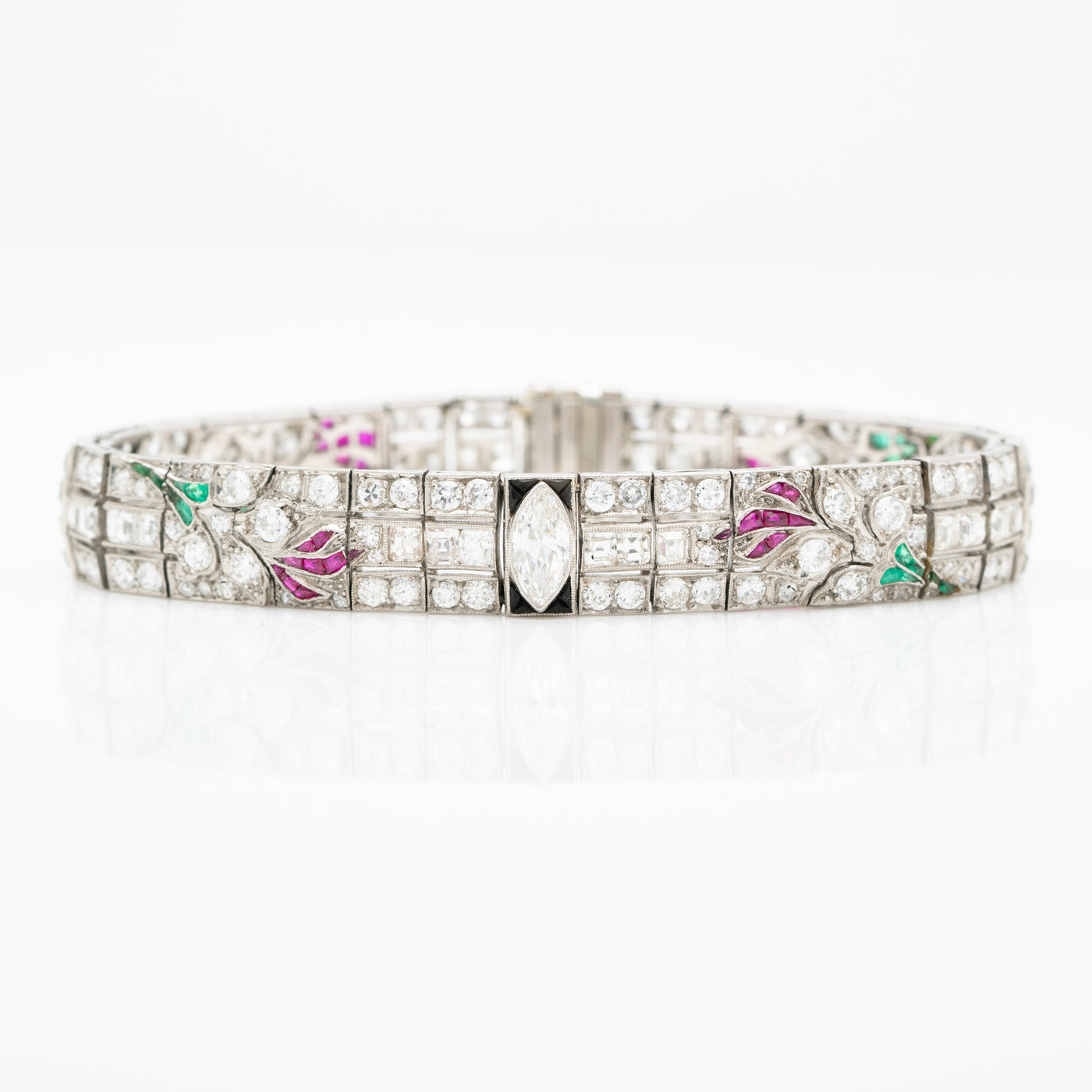 ART DECO PLATINUM OLD EUROPEAN CUT AND CARRE CUT DIAMOND AND COLOMBIAN EMERALD, ONYX AND RUBY c.1920s
