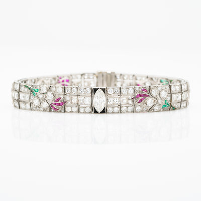 ART DECO PLATINUM OLD EUROPEAN CUT AND CARRE CUT DIAMOND AND COLOMBIAN EMERALD, ONYX AND RUBY c.1920s