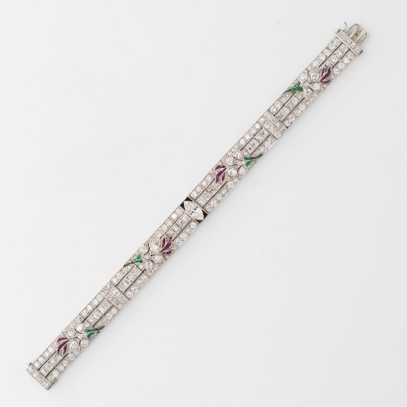 ART DECO PLATINUM OLD EUROPEAN CUT AND CARRE CUT DIAMOND AND COLOMBIAN EMERALD, ONYX AND RUBY c.1920s