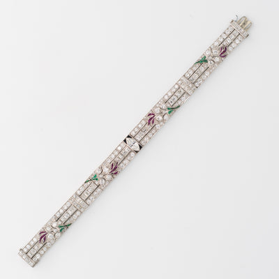ART DECO PLATINUM OLD EUROPEAN CUT AND CARRE CUT DIAMOND AND COLOMBIAN EMERALD, ONYX AND RUBY c.1920s