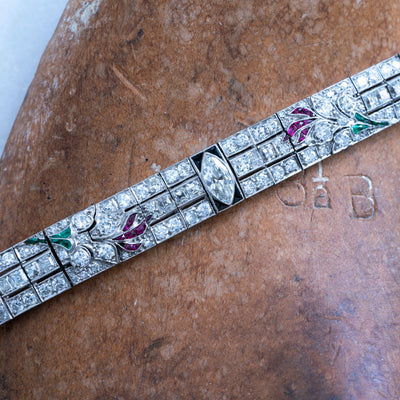 ART DECO PLATINUM OLD EUROPEAN CUT AND CARRE CUT DIAMOND AND COLOMBIAN EMERALD, ONYX AND RUBY c.1920s